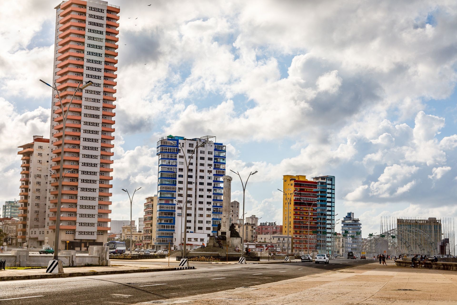 Modern resedential buildings close to Malecon promenade and road with cars, Vedado, Havana, Cuba